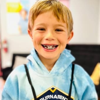 kid smiling with braces